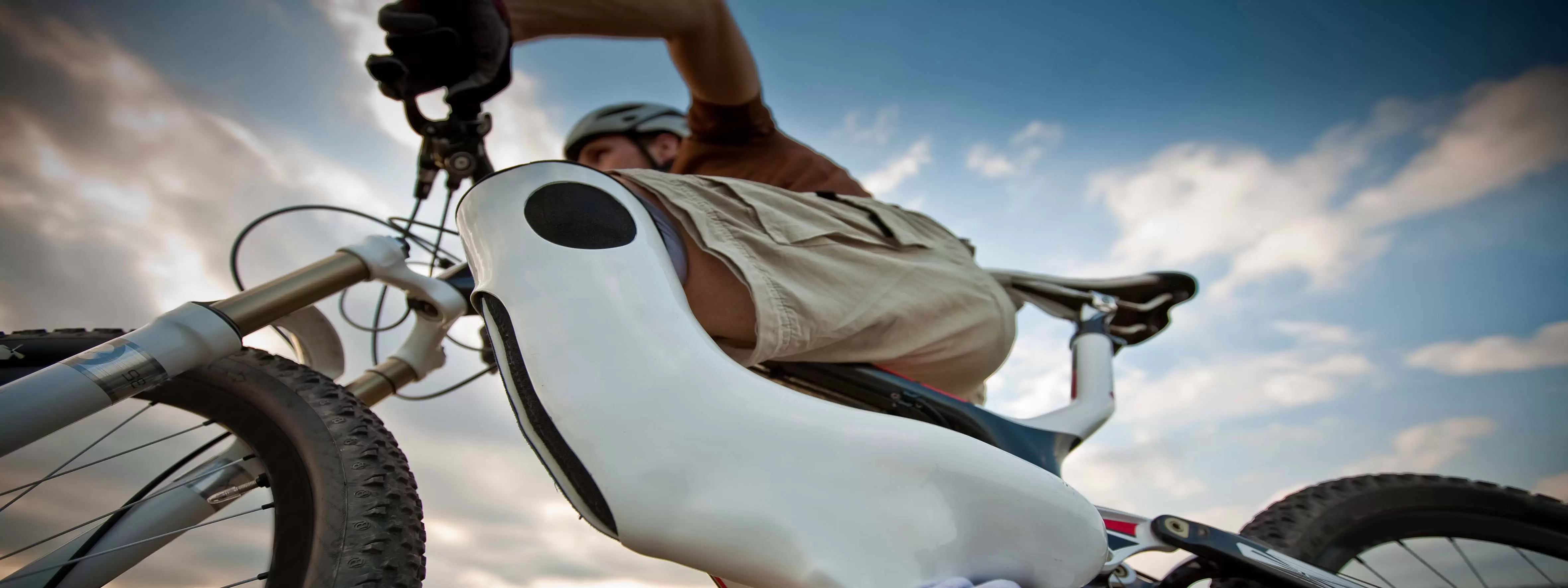 A boy on a bike, using assistive technology